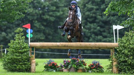 Alice Casburn and Topspin take a cross-country fence on the way to topping the 2026 Bramham Horse Trials results in the under-25 class.