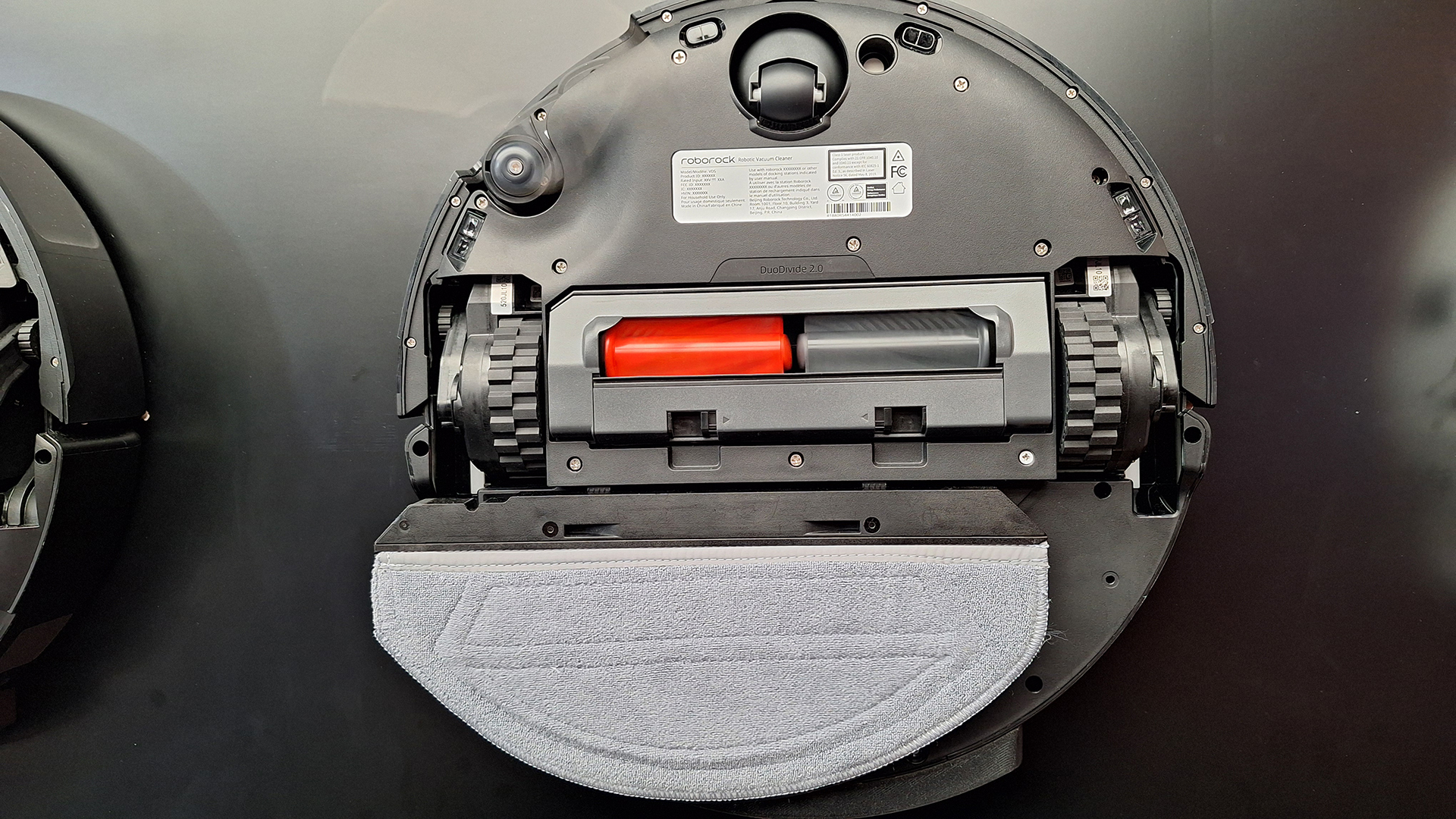 Roborock Saros 20 Sonic robot vacuum flipped over to show mop system beneath