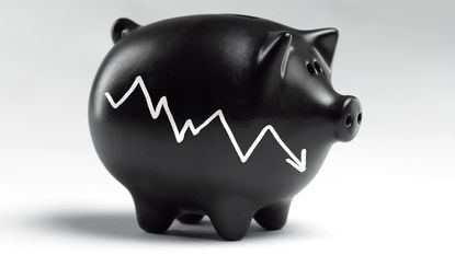 A black piggybank with a jagged downward arrow on its side that looks like a stock market indicator.
