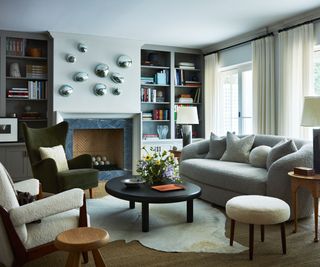 living room with gray sofa and black coffee table
