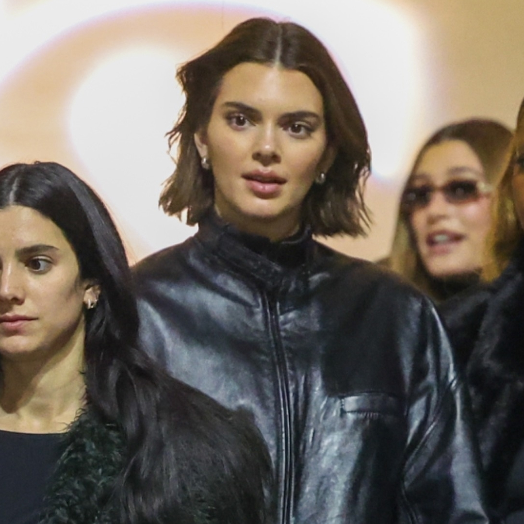 Kendall Jenner wears a leather bomber jacket with a mini skirt while attending the sabrina carpenter concert