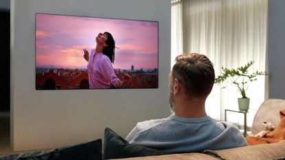 LG 8K TV being watched by an adult human male