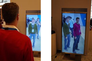 On the left, a model uses Memomi's mirror to see how his sweater would look in a different color; on the right, a split-screen effect shows two colors side-by-side.
