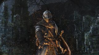 Dark Souls' Chosen Undead stands in front of a campfire.