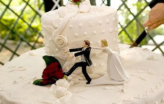 Wedding cake topper featuring bride and groom