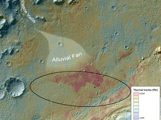 This false-color map shows the area within Gale Crater on Mars, where NASA's Curiosity rover landed on Aug. 5, 2012 PDT (Aug. 6, 2012 EDT). It merges topographic data with thermal inertia data that record the ability of the surface to hold onto heat. Red indicates a surface material that retains its heat longer into the evening, suggesting differences relative to its surroundings. Image released September 27, 2012.