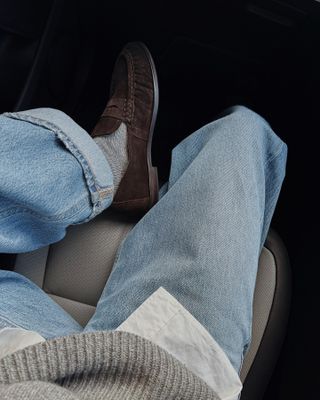 Influencer wears suede loafers with jeans and grey socks