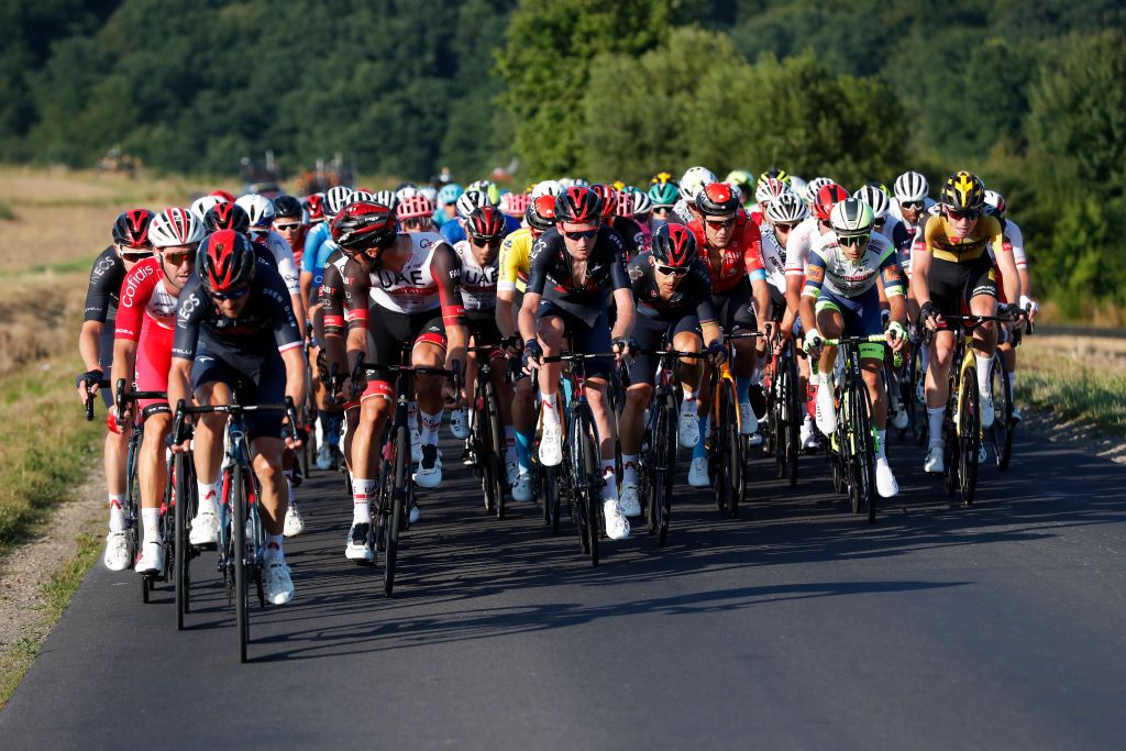 PRZEMYSL POLAND AUGUST 10 LR Michal Golas of Poland and Team INEOS Grenadiers Oliviero Troia of Italy and UAE Team Emirates Tao Geoghegan Hart of The United Kingdom Michal Kwiatkowski of Poland and Team INEOS Grenadiers Phil Bauhaus of Germany and Team Bahrain Victorious Yellow Leader Jersey Quinten Hermans of Belgium and Team Intermarch Wanty Gobert Matriaux David Dekker of The Netherlands and Team JumboVisma lead The Peloton during the 78th Tour de Pologne 2021 Stage 2 a 201km stage from Zamo to Przemyl 341m TourdePologne TDP2021 UCIWT on August 10 2021 in Przemysl Poland Photo by Bas CzerwinskiGetty Images