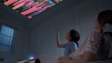Acer C250i review: woman and child watching TV on the ceiling