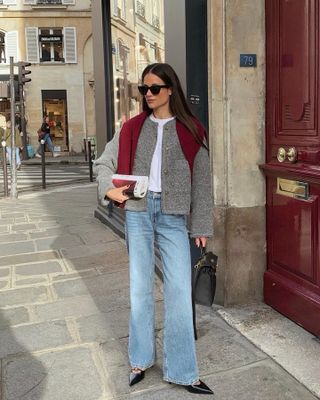 French fashion influencer Julie, a.k.a. @leasy_inparis, wearing a chic fall sweater outfit.