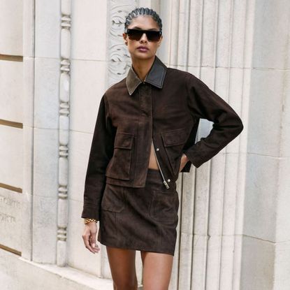 A woman wearing some autumn basics on sale from the article