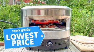 Solo Stove Pi Prime Pizza Oven shown cooking a pizza outdoor