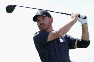 Oosthuizen watches his tee shot after hitting driver