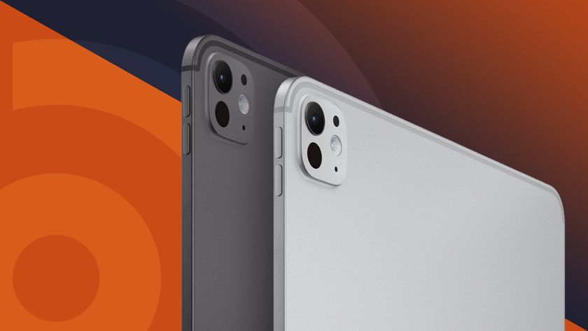 Apple iPad Pro in silver and black on top of TechRadar logo in orange