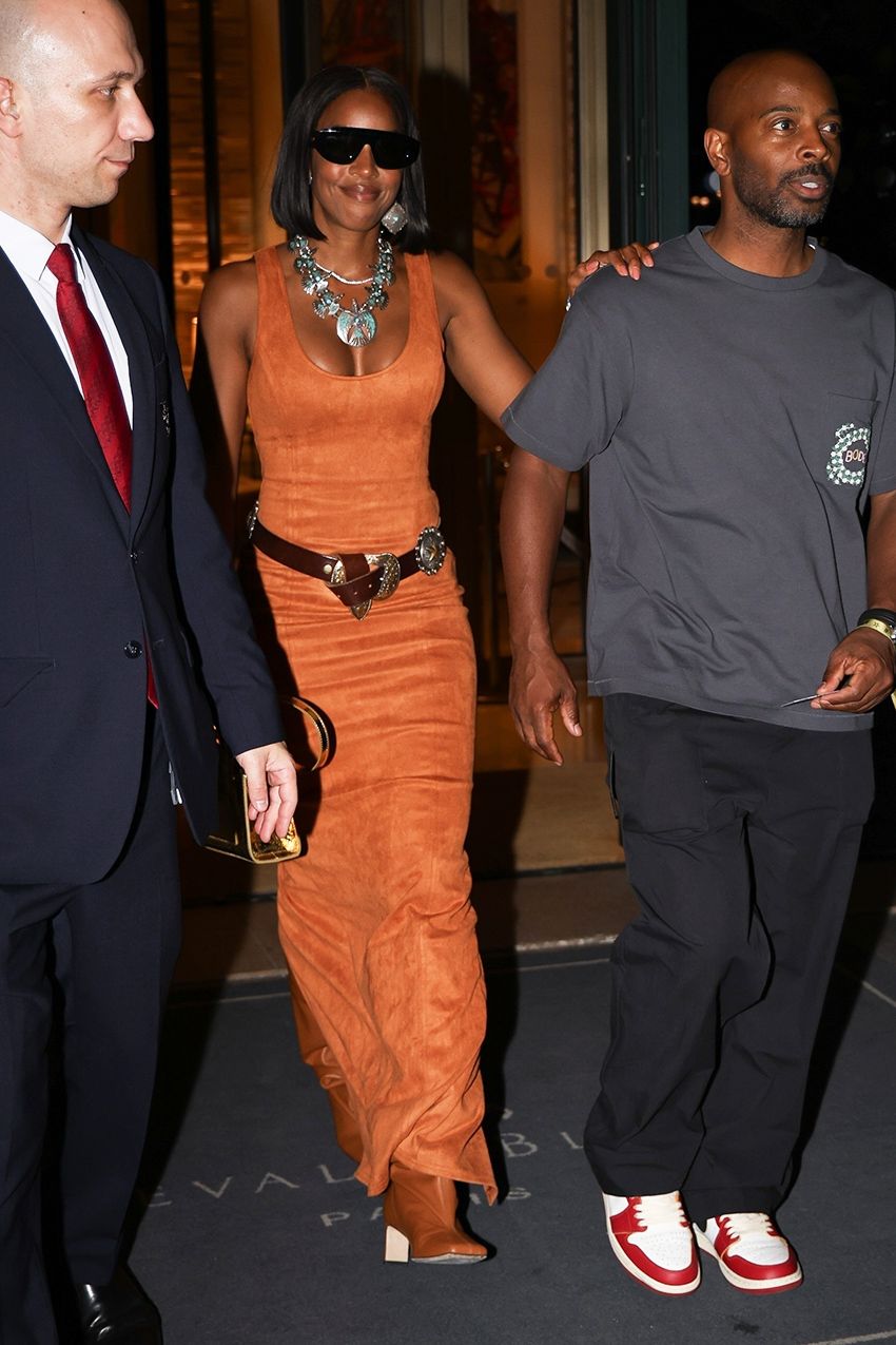 Kelly Rowland wearing an orange dress and belt in Paris