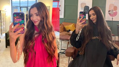 Dionne Brighton in a pink dress, taking a mirror selfie to show the after result of the concave cut. Smiling, feeling very happy with the result.