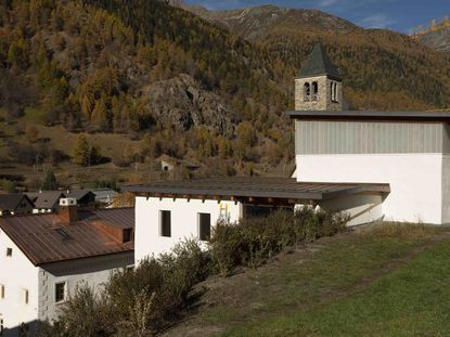 Outside of Muzeum Susch with views of green hills