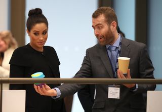 Meghan, Duchess of Sussex looks at reusable coffee cups during a visit to the Association of Commonwealth Universities at University Of London on January 31, 2019 in London, England. In her new role as Patron of the international organisation which is dedicated to building a better world through higher education, the Duchess met students from the Commonwealth now studying in the UK, for whom access to university has transformed their lives.