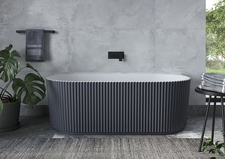 gray bathroom with dark gray colored fluted freestanding bath showing the latest bathroom trends of 2022