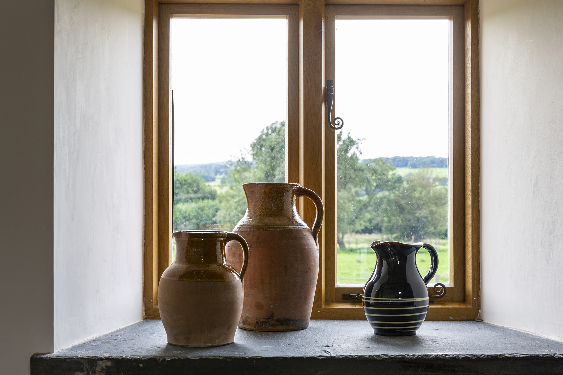 window sill with salvaged slate and view from restored Welsh barn