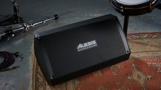 Alesis Strike Amp 12 MK2 on a rug