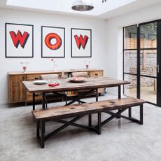 dining room with white walls and wooden table 