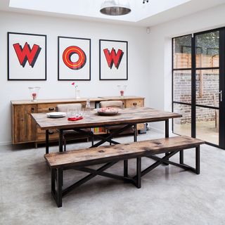 dining room with white walls and wooden table