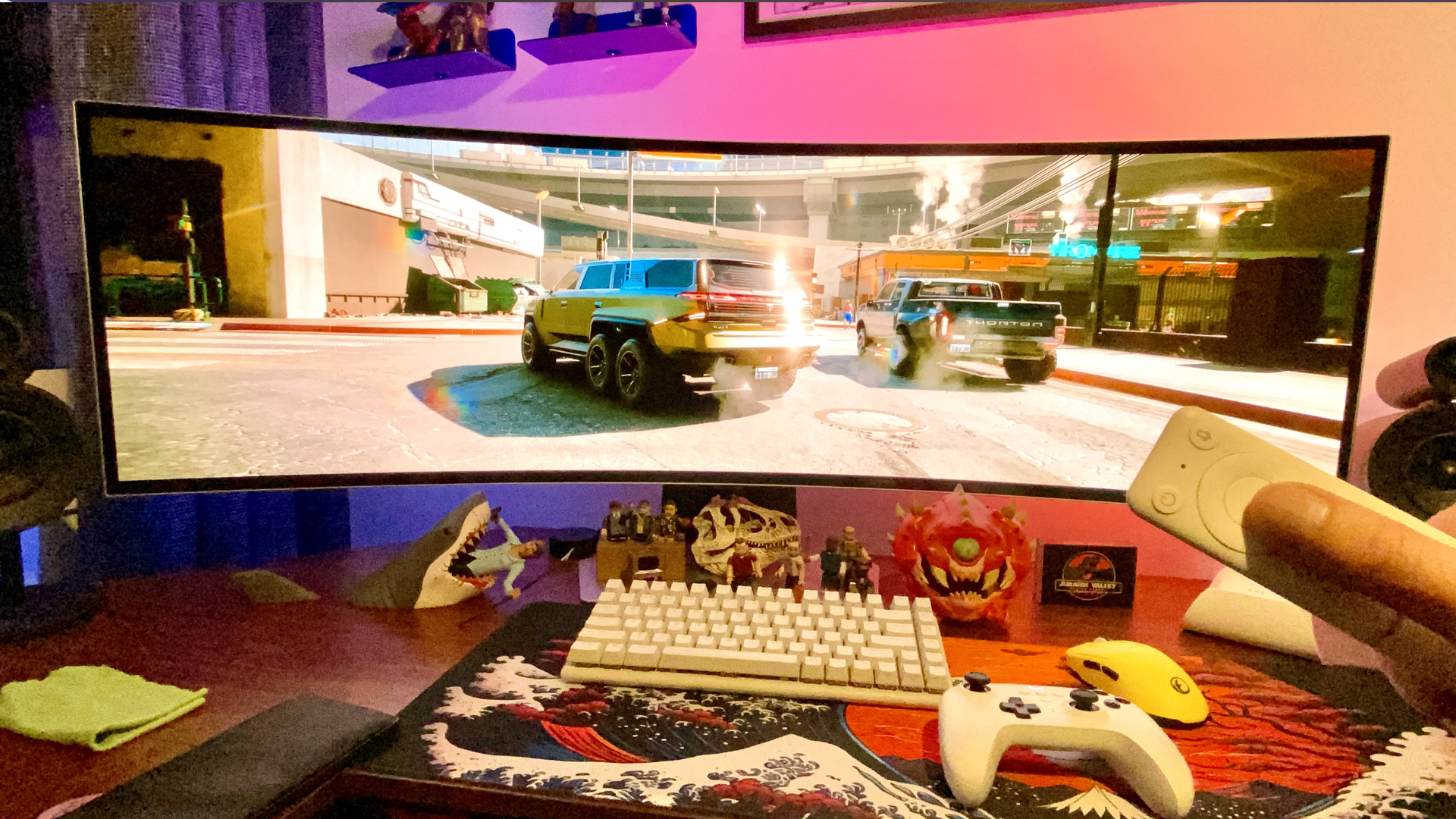 A car driving through Night City in Cyberpunk 2077 on a Samsung Odyssey OLED G9 monitor.