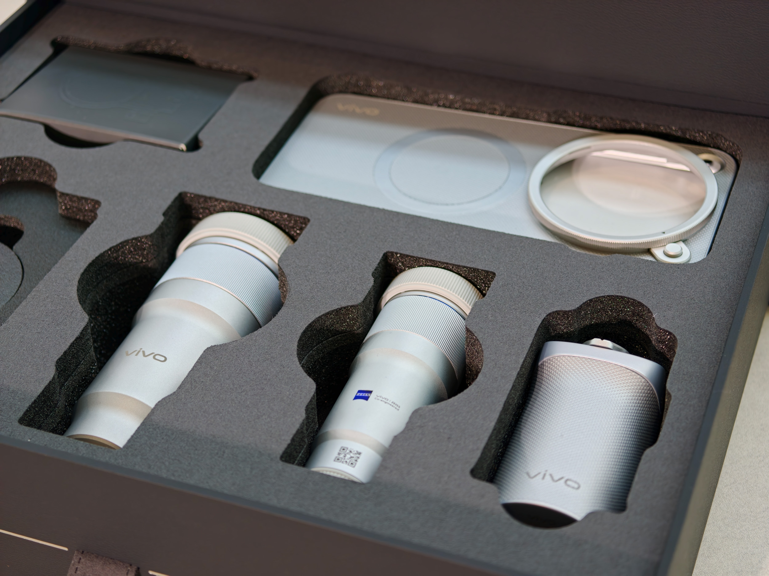 The Vivo X500 Pro Max phone complete photographer's kit, with telephoto converters, grip, additional cases and more, in black presentation box