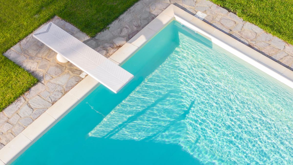 An overhead view of a clean blue swimming pool