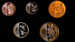 Newly designed coins featuring depictions of the UK's flora and fauna displayed by the Royal Mint in London