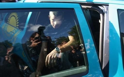 Italy's Paolo Savoldelli gets into a team car