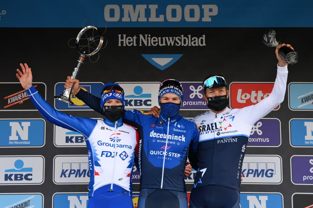 Team GroupamaFDJ British rider Jake Stewart team Deceuninck QuickStep Italian rider Davide Ballerini and team Israel StartUp Nation Belgian rider Sep Vanmarcke pose on the podium of the World Tour 2021 Omloop Het Nieuwsblad one day semiclassic cycling race from Gent to Ninove on February 27 2021 Photo by DAVID STOCKMAN Belga AFP Belgium OUT Photo by DAVID STOCKMANBelgaAFP via Getty Images