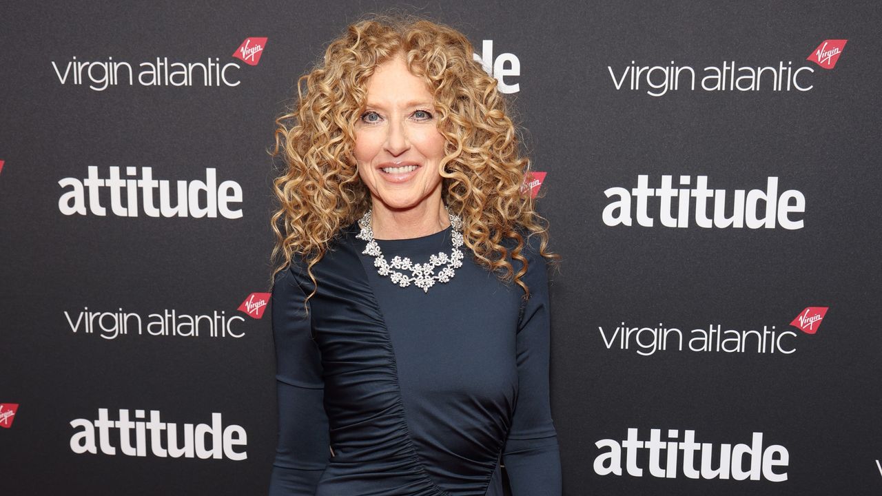 Kelly Hoppen on the red carpet in a black dress