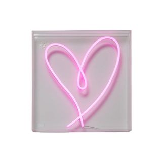 A pink heart neon light