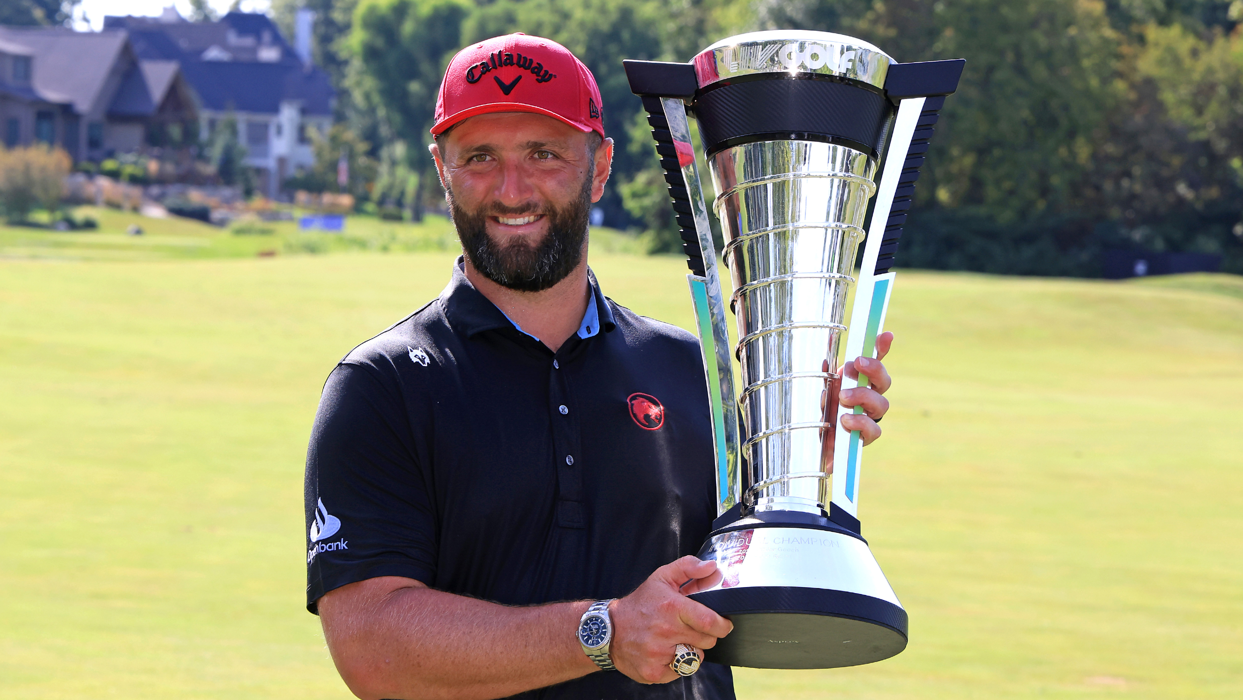 Jon Rahm with the Individual Championship trophy