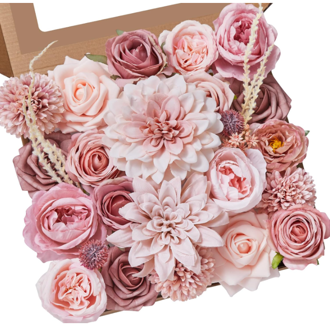 a box of assorted faux pink flowers for baby showers