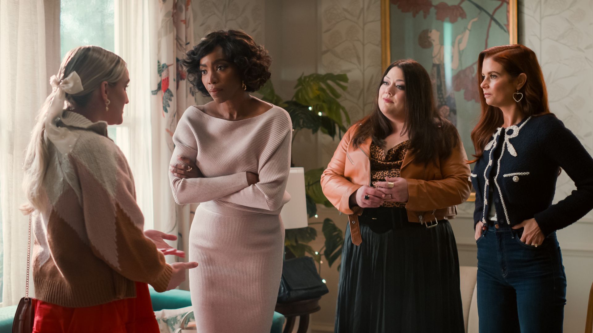 Helen, Dana Sue and Maddie talk to a blonde woman with a white bow in her hair