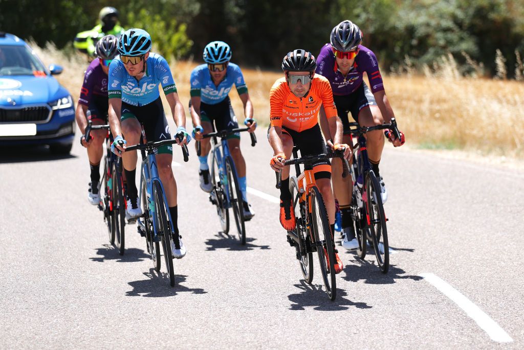ARANDA DE DUERO SPAIN AUGUST 06 LR Marton Dina of Hungary and EoloKometa Cycling Team Mikel Bizkarra Etxegibel of Spain and Team Euskaltel Euskadi in the Breakaway during the 43rd Vuelta a Burgos 2021 Stage 4 a 149km stage from Roa to Aranda de Duero VueltaBurgos BurgosCycling CapitalMundialdelCiclismo on August 06 2021 in Aranda de Duero Spain Photo by Gonzalo Arroyo MorenoGetty Images