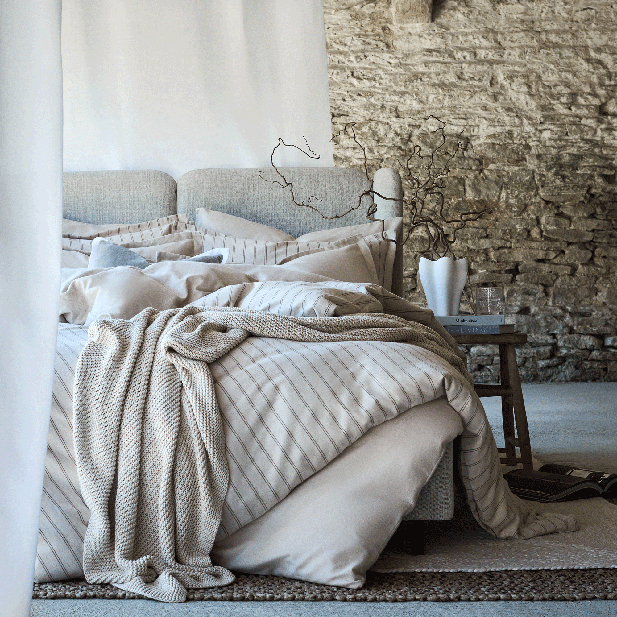 Flannel stripe bedding on a grey bed