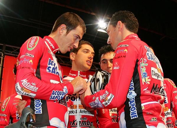 Riders confer during the team presentation.
