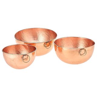 A set of three copper hammered bowls