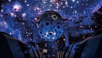 An immersive planetarium with stars on the sky of a domed screen. 
