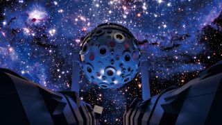 An immersive planetarium with stars on the sky of a domed screen. 