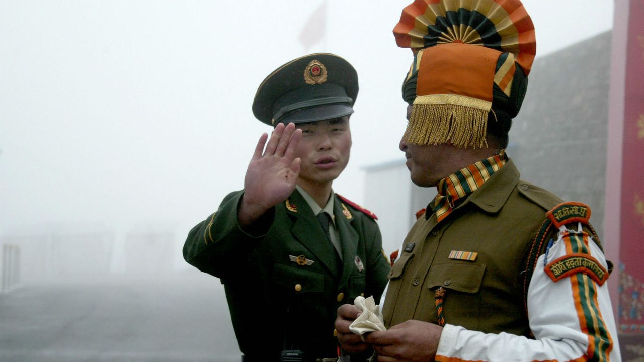 A Chinese border guard confronts an Indian solider at the ancient Nathu La border crossing