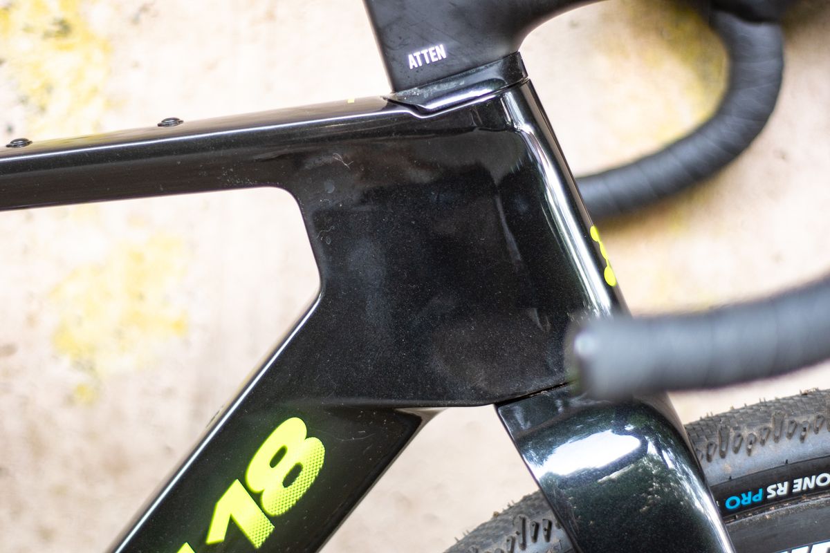 An Argon 18 Anti Matter gravel bike leaning against a concrete wall.