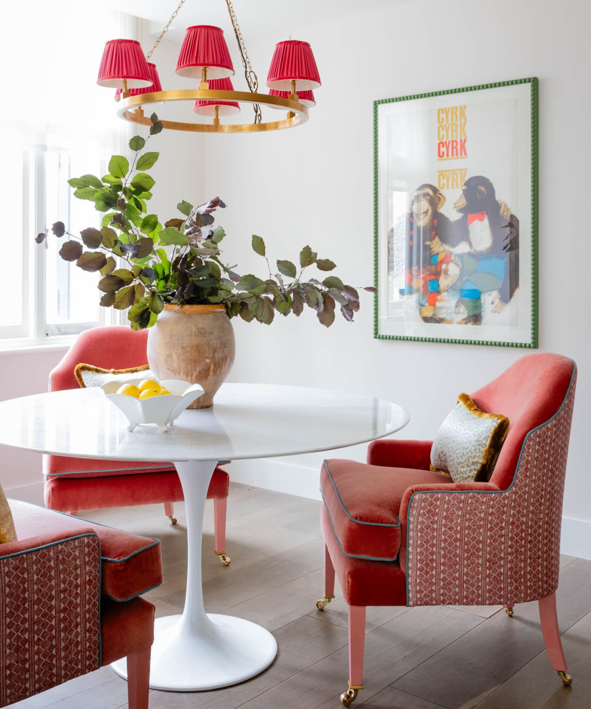 Dining space by Sean Symington featuring coral chairs and lampshades, photographs Chris Wakefield