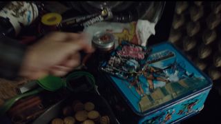 Wade looking at a He Man Lunch Box in Ready Player One