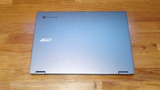 Acer Chromebook Spin 514 review; an closed laptop on a wooden bench