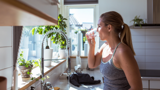 Woman drinking glass of water